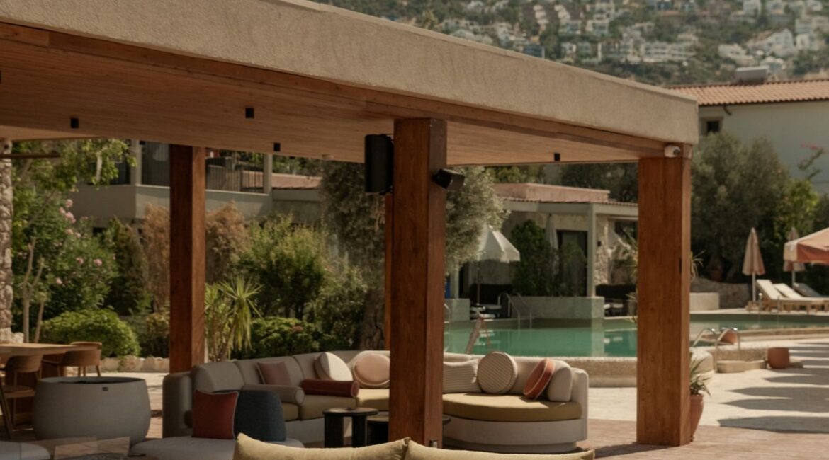 Stylish outdoor lounge and restaurant terrace at Asfiya Sea View overlooking Kalkan Bay.